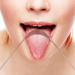 Load image into Gallery viewer, A closeup of a woman cleaning her tongue with a copper tongue scraper