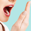 Load image into Gallery viewer, A woman is holding her mouth open and smelling her breath