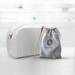 Load image into Gallery viewer, Medi Grade copper tongue scarper cleaner beside its drawstring storage bag and pouch behind