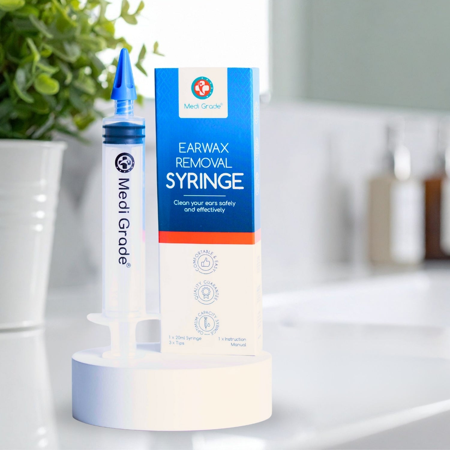 Medi Grade earwax removal syringe with packaging on a bathroom counter.