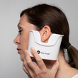 Load image into Gallery viewer, A woman holding an ear basin below her ear