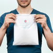 Load image into Gallery viewer, A man holding the Medi Grade Vomit Bag