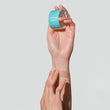 Load image into Gallery viewer, A hand applying a scar tape on his/her forearm with scar tape on the other hand
