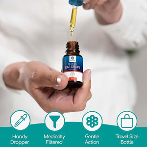 A hand holding a bottle of olive oil ear drops bottle and dropper with icons below for handy dropper, medically filtered, gentle action, & travel size bottle