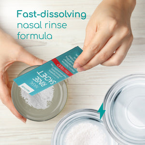 Contents of the nasal rinse sachet being poured into a clear container with other containers beside it showing the before and after picture of the contents being dissolved