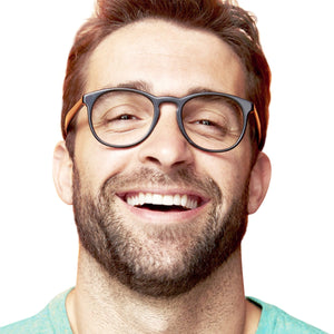A man wearing glasses smiling
