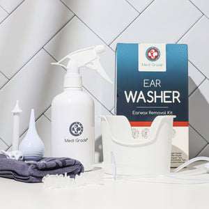 Ear Washer Bottle, ear basin, different tips, ear bulb, towel, its retail box in a bathroom setting